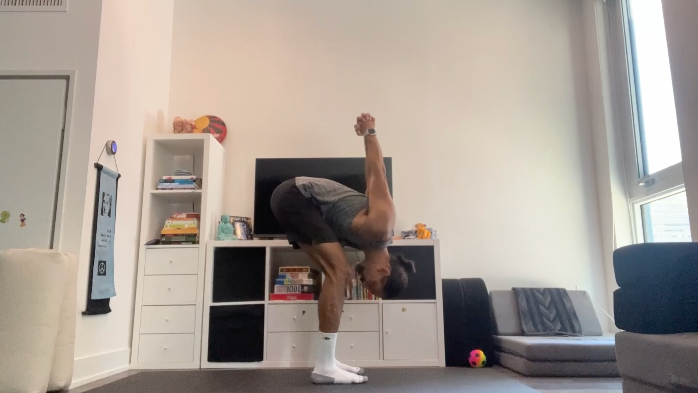 Yoga teacher Jaffer Hussain in Standing Forward Bend variation, part of his yoga for tech neck practice